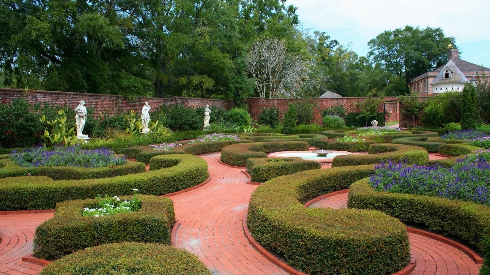 A formal knot garden with clipped box hedging